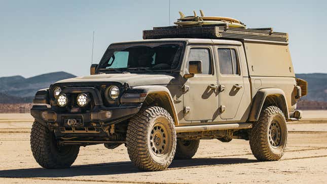 A photo of a Go Fast Camper tent mounted to the roof of a Jeep Gladiator pickup. 